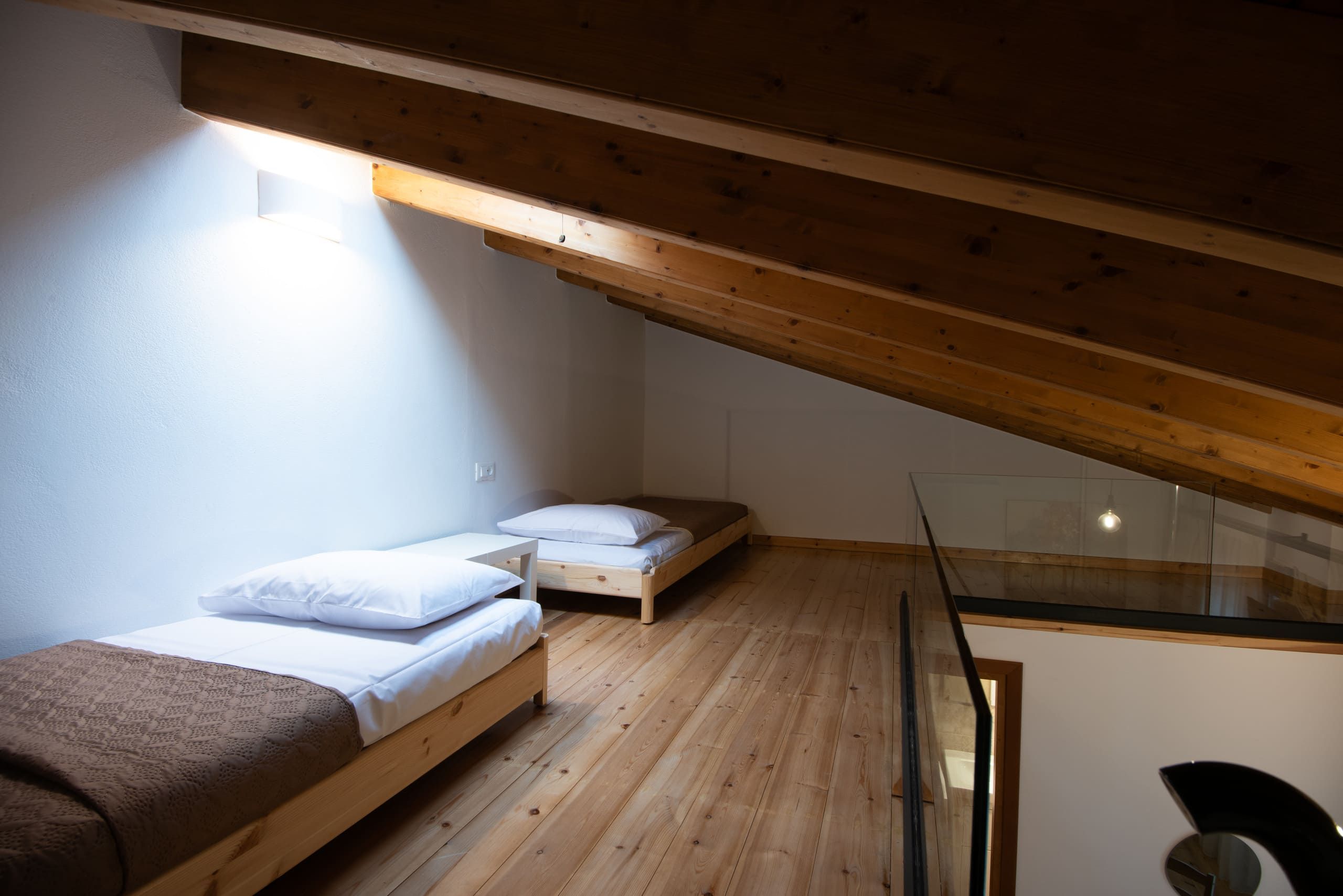 Two single beds under the wooden roof